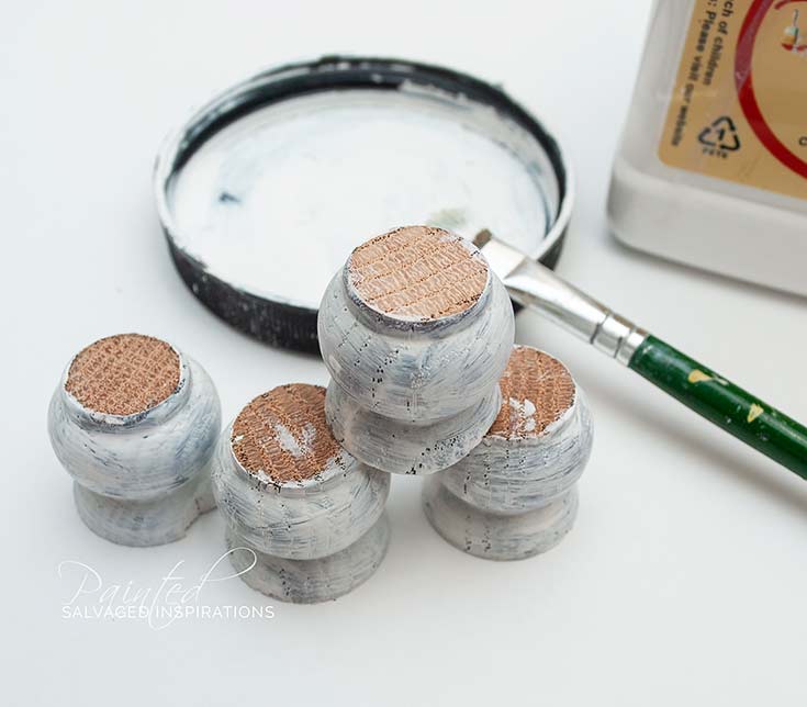 Chair Spindles Being Painted for Tray Feet