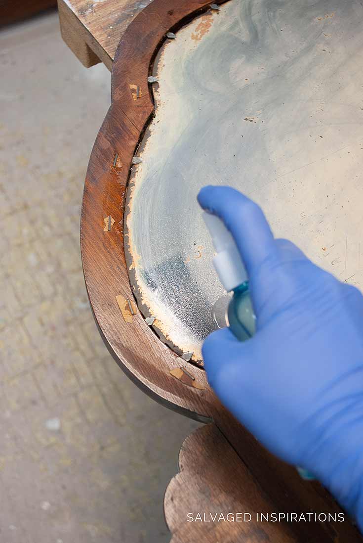 Spraying Bleach To Antique Mirror