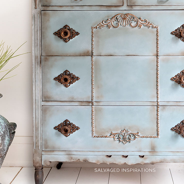 Close Up of Copper Gilded Trim Design on Dresser