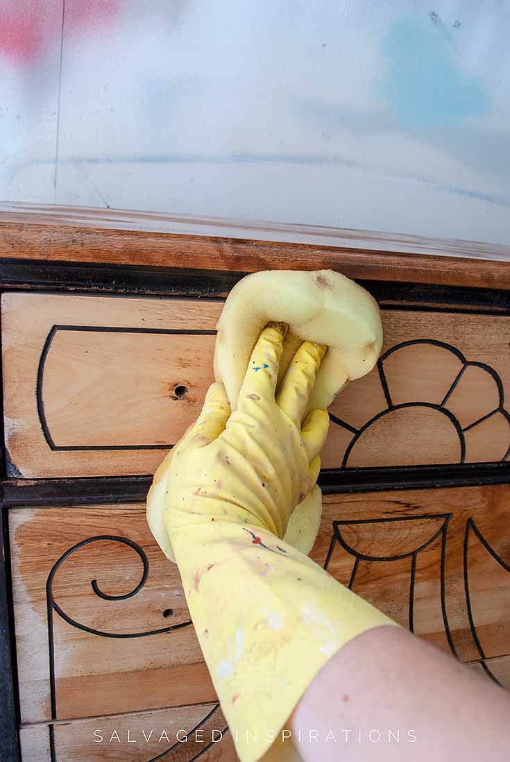 Wiping Bleach Off Wood With Damp Sponge