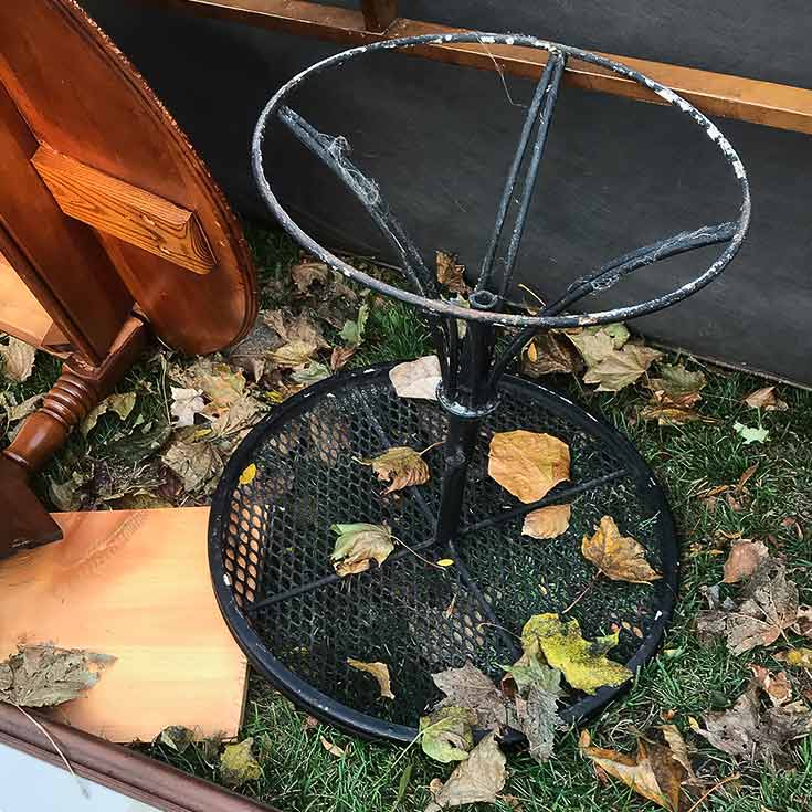 Rusted Metal Table in Trash