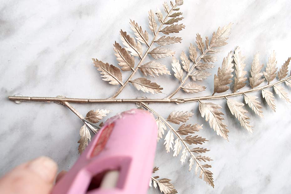 Gluing on Faux Greenery Art
