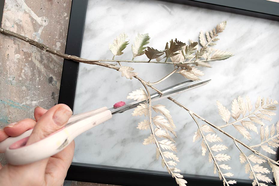 cutting faux painted greenery