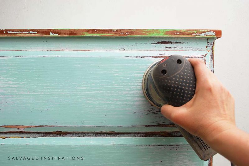 Sanding layers of paint off CurbShopped Dresser